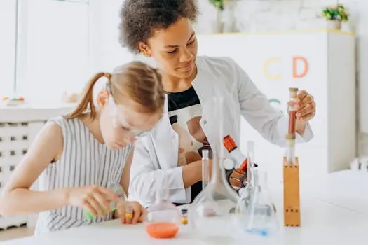 A teacher and student engage in a hands-on science experiment in a classroom setting.