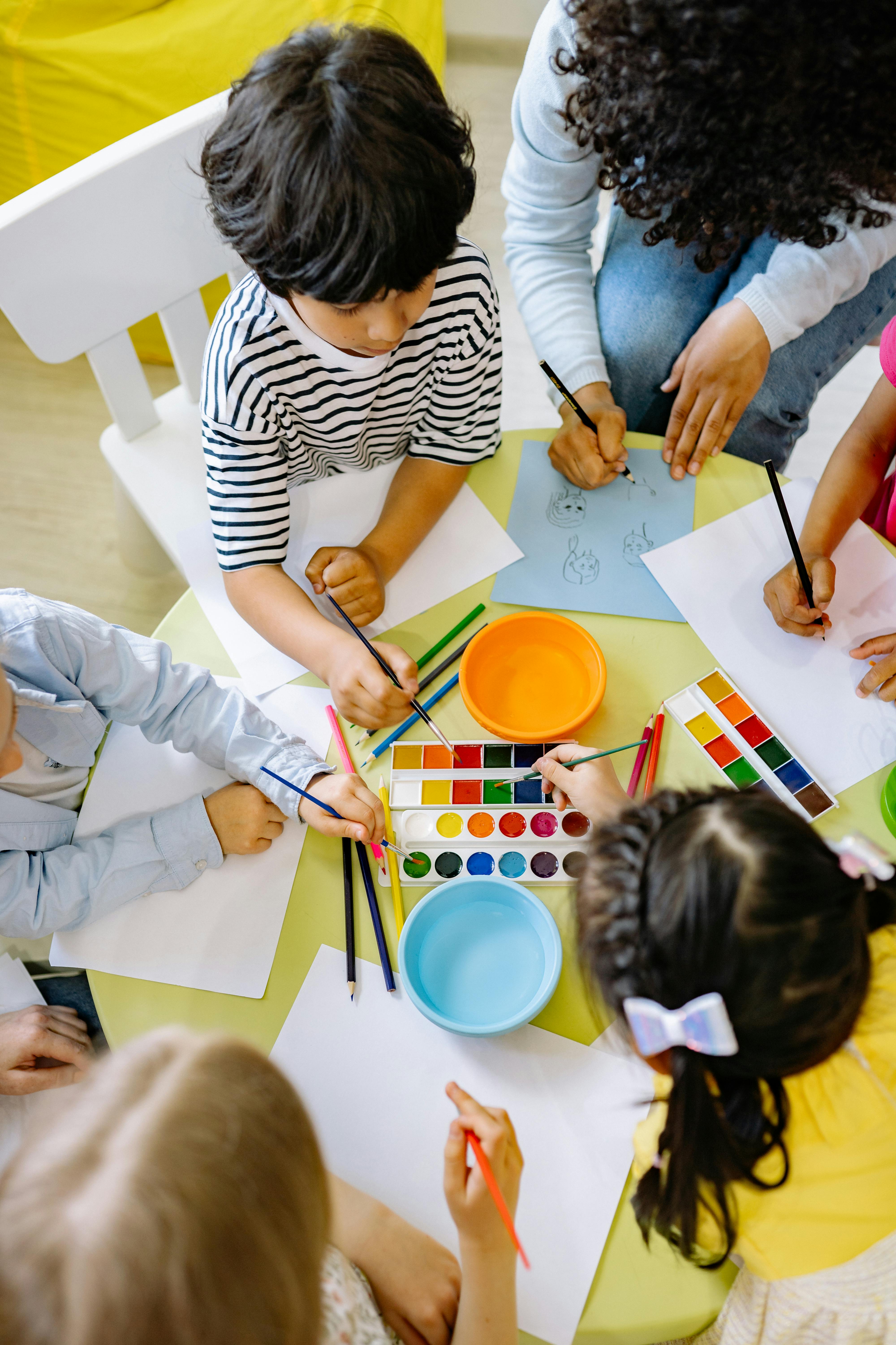 Preschool kids busy with coloring and creative play